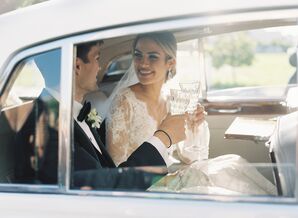 Elegant Couple Toasting in Car