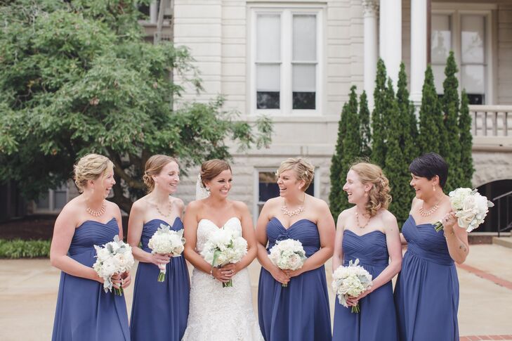 The bridesmaids wore marine blue strapless gowns.