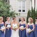 The bridesmaids wore marine blue strapless gowns.