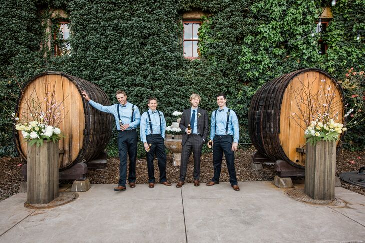 "The groomsmen wore navy blue pants by Dockers with navy blue suspenders, along with  a white Kenneth Cole button-up shirt and a blue and green plaid bow tie," Michelle says. "Ryan and the groomsmen wore brown oxford shoes."