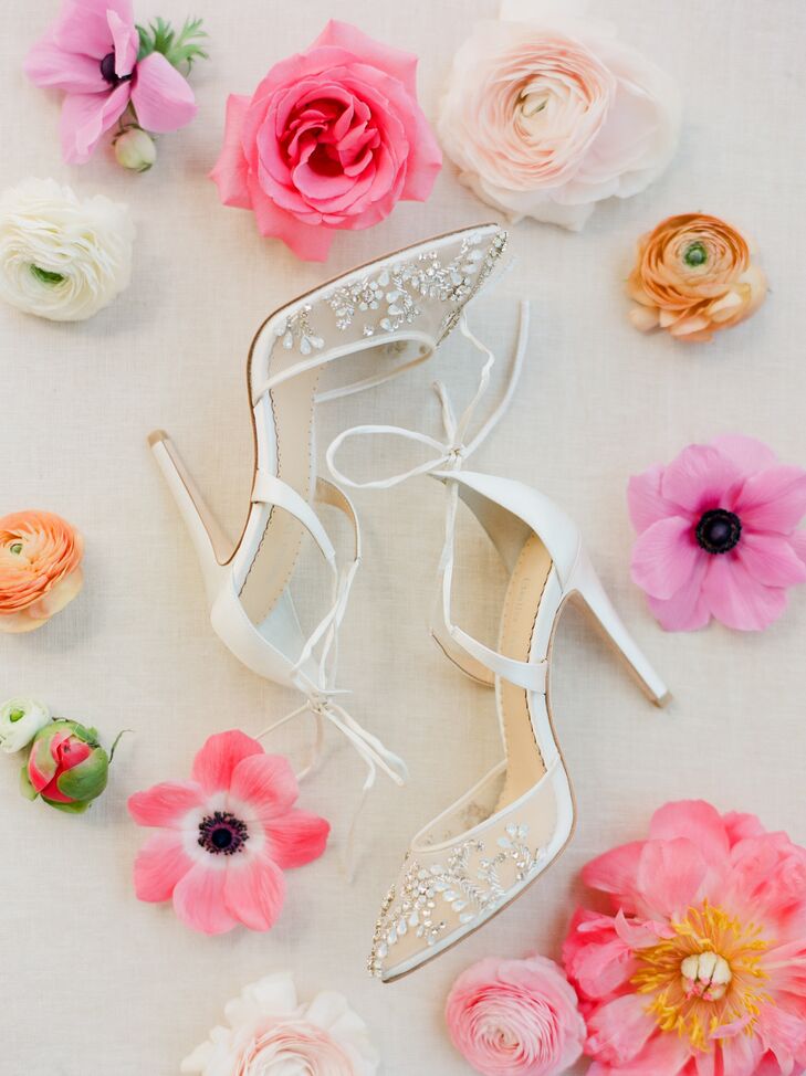 Deborah wore a pair of pointed-toe white lace heels by Bella Belle.