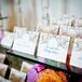 Gold and Teal Calligraphed Tented Escort Cards