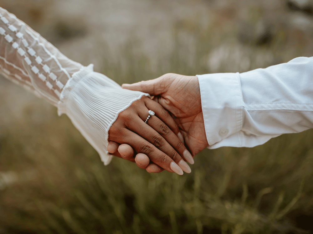Fiances holding hands