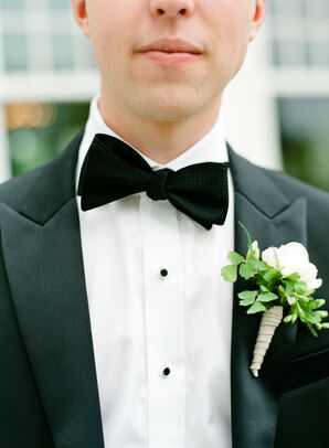 Green and White Boutonniere with Black Bow Tie