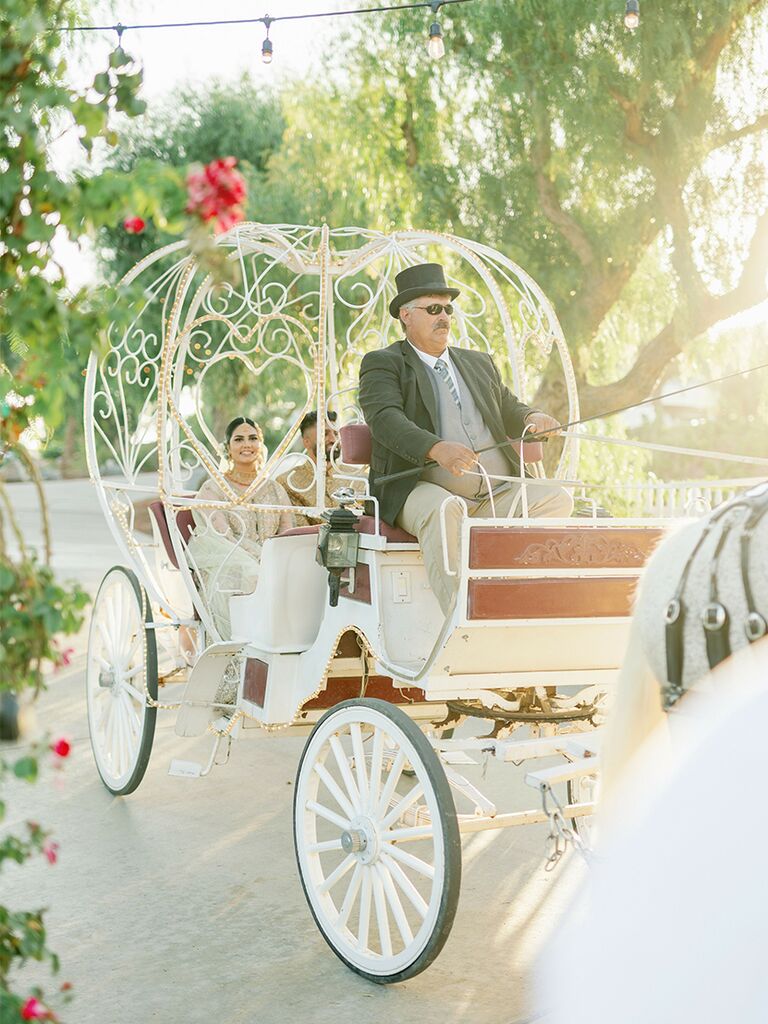 Horse-drawn carriage at fairytale-themed wedding