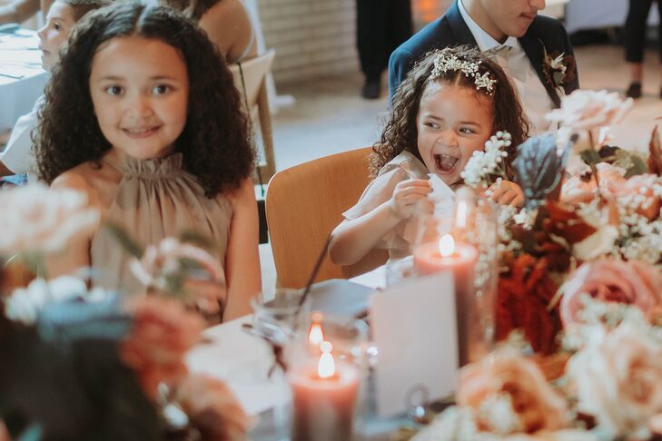 Couple's Young Daughters as Maid of Honor and Flower Girl at Fall Themed Reception Table