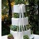 Decorated with more hydrangeas and satin ribbons, the enormous cake had three-tiers and white fondant.