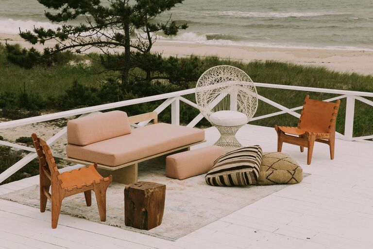 Boho lounge furniture on deck overlooking beach
