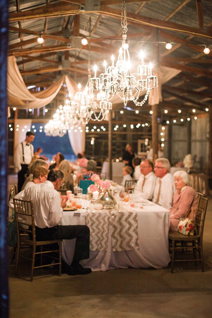 “I run a teen fashion and celebrity magazine entitled Glitter, so that was the inspiration,” Nikki says. The barn was decorated with large chandeliers, string lights and white drapery.