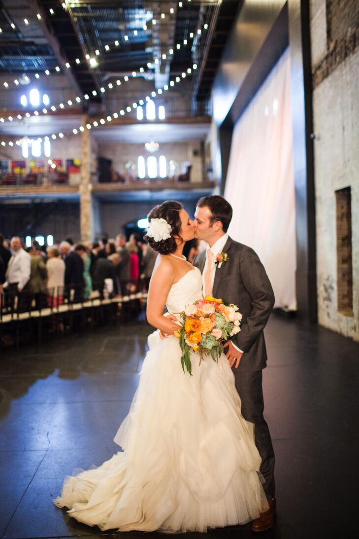 "Brett Dorrian is the goddess of bridal hair and makeup," Molly says. "Seriously, a genius." She wanted her hair to be beautiful and casual to reflect her dress, and Brett did exactly that. He styled her hair in a low side bun and finished it with an oversize white flower.