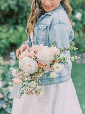 Bride Wearing Denim Jacket Holding Peony Bouquet