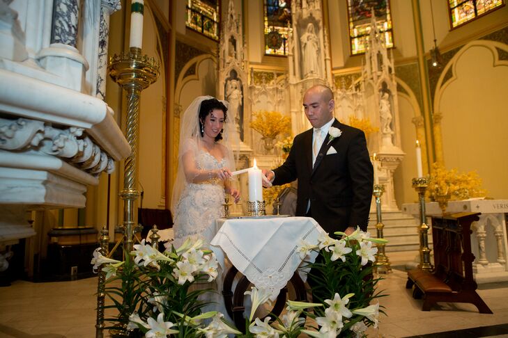 To symbolize their union, Marielle and Roderick lit a single candle, using their own individual taper candles.