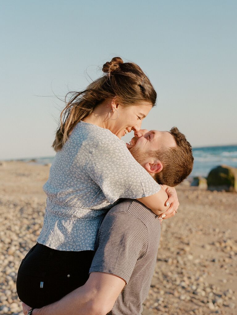 Couple nose kiss on a beautiful beach. 