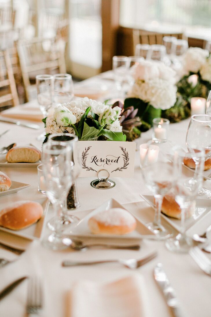 Instead of picking a specific seat or table for their guests, Janel and Charlie chose a more free-form approach. They let everyone sit or move around as they liked; a “reserved” sign marked only the head table. Keeping with their natural theme, two illustrations of lavender surrounded the card.