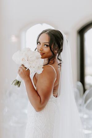 Bride With Updo and Veil Holding White Bouquet