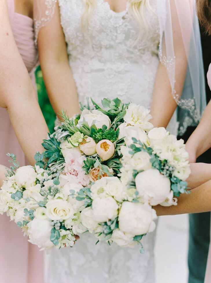 Lauren and her bridesmaids carried garden-inspired bouquets including white peonies, blush garden roses and lots of greenery.