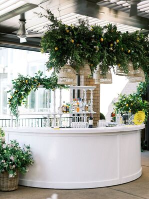 White Rehearsal Dinner Bar With Hanging Lemons, Greenery and Rattan Chandeliers