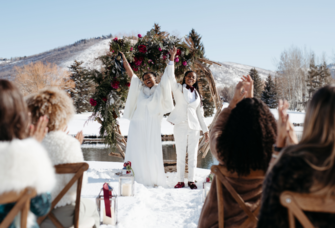 lesbian couple celebrating getting married in front of Utah mountains