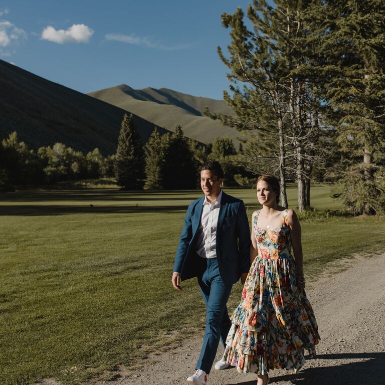 Walking near the mountains engagement photo
