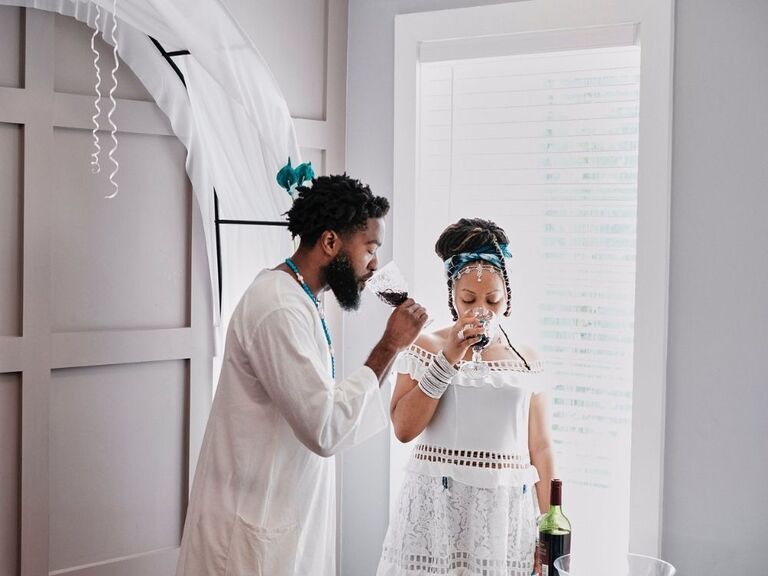 couple participating in wedding libation ceremony