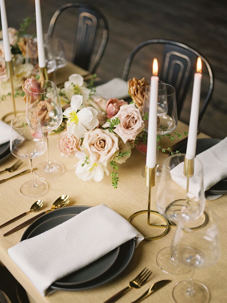 Wedding floral table centerpieces of roses and greenery
