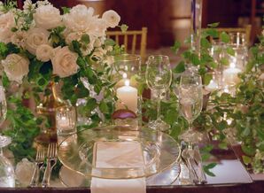 Place Setting with Greenery, Candles and Glass Dinnerware