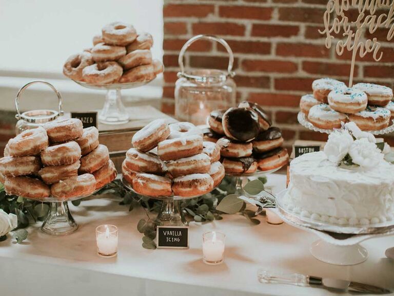Assorted glazed donut spread at wedding