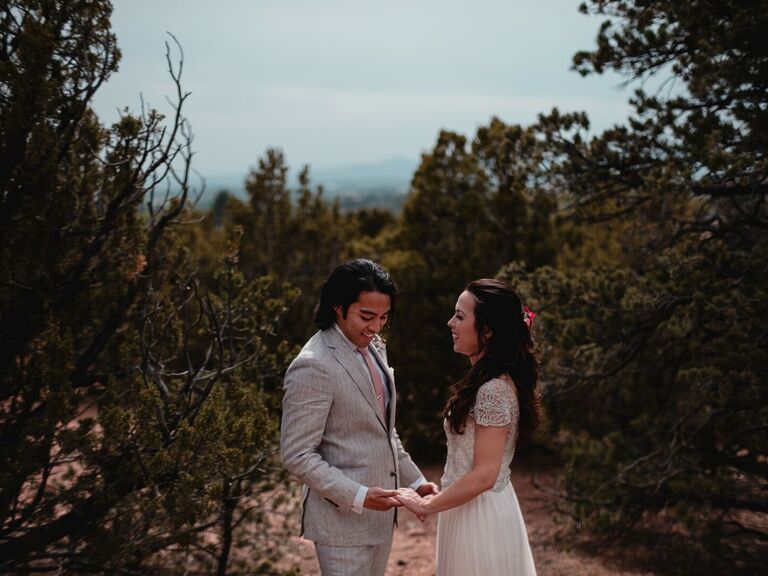 Couple holding hands laughing