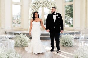 Bride and Groom in Front of Lush Wedding Arch at Knotting Hill Place in Little Elm, Texas