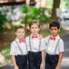 Ring Bearers in Suspenders and Coral Bow Ties