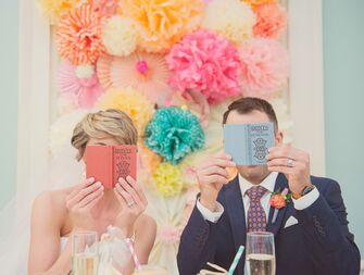 Newlyweds looking at wedding books
