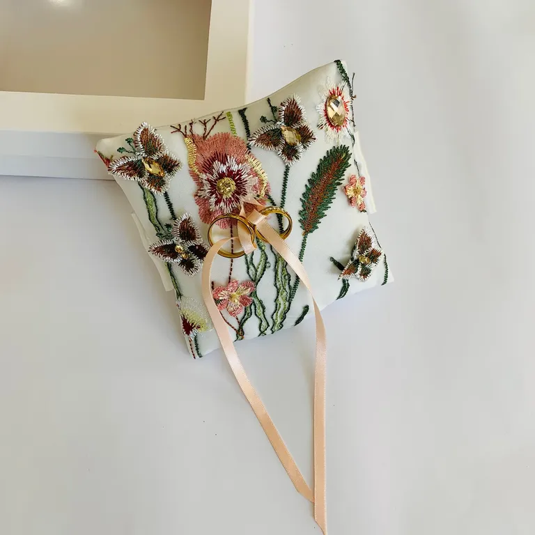 Ivory ring bearer pillow with embroidered floral detail
