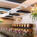 Wine Barrel Decor Among Colorful Rehearsal Dinner Dining Area