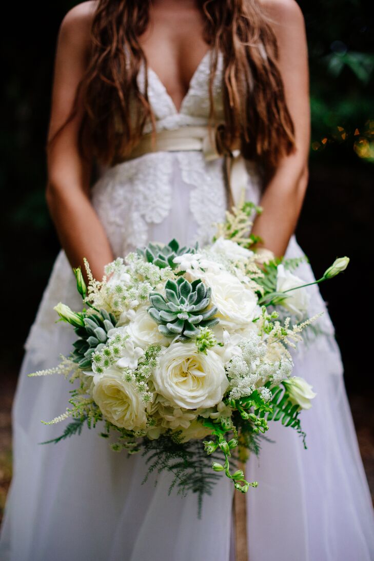 Brooke carried a romantic bouquet of full, ivory garden roses, Queen Anne's lace, wispy ferns and succulents down the aisle.