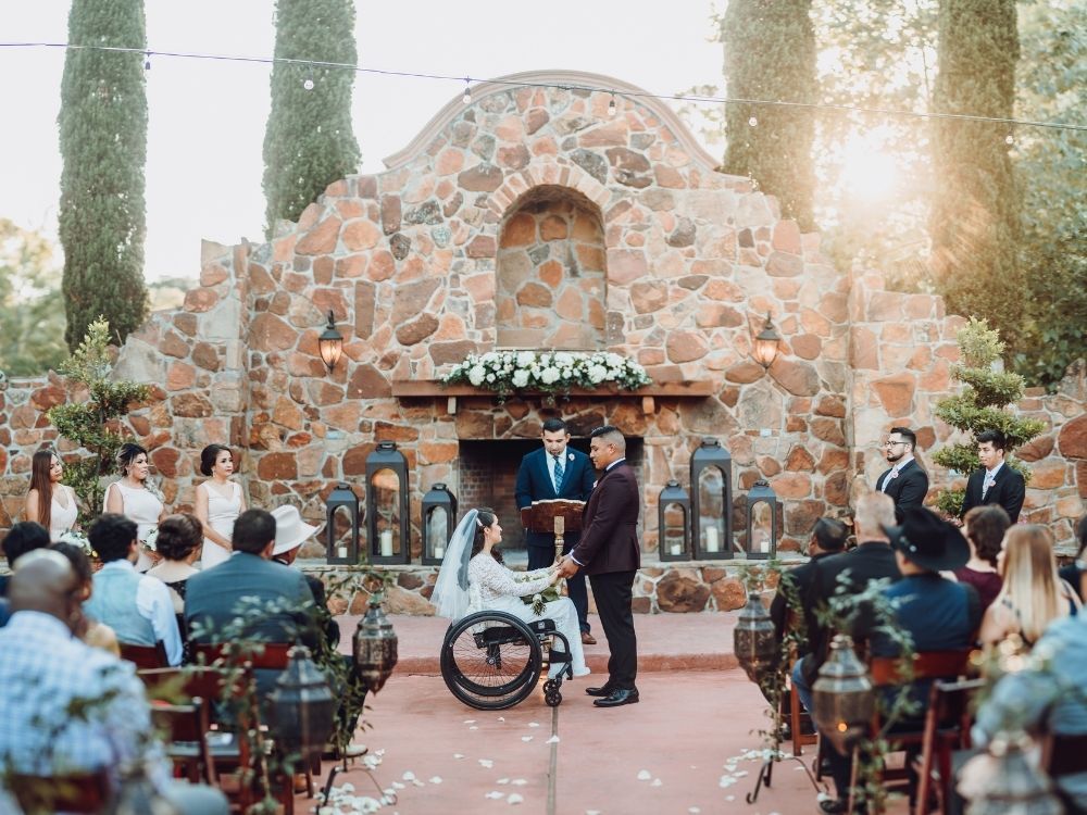 bride and groom exchanging traditional wedding vows at outdoor wedding ceremony