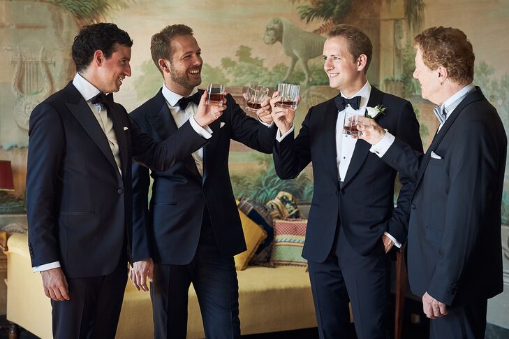 The groomsmen share a toast before walking over to the wedding at Villa di Geggiano in Tuscany, Italy.