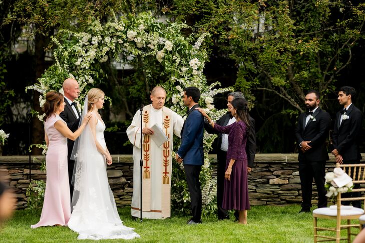 Catholic Priest Officiant at Garden Wedding Ceremony