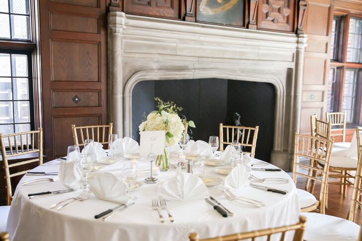 The decor in the Saturn Room was kept to a minimum, with gold chiavari chairs and neutral linens paired with elegant hydrangea-filled centerpieces.