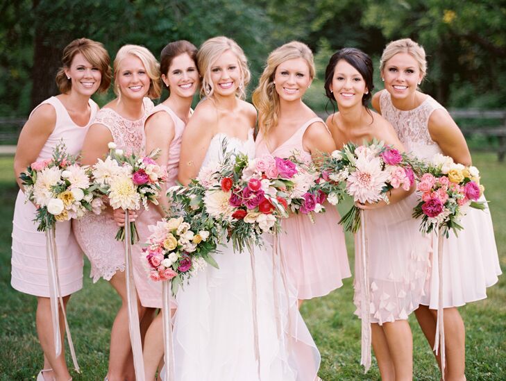 To keep things feeling casual, yet still elegant and ethereal, Kristina had her six bridesmaids choose their own dresses, each in a soft shade of pale pink or peach.
