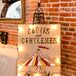 Maggie and Doug brought their vintage circus theme to life with DIY elements like red velvet curtains and funky signs.