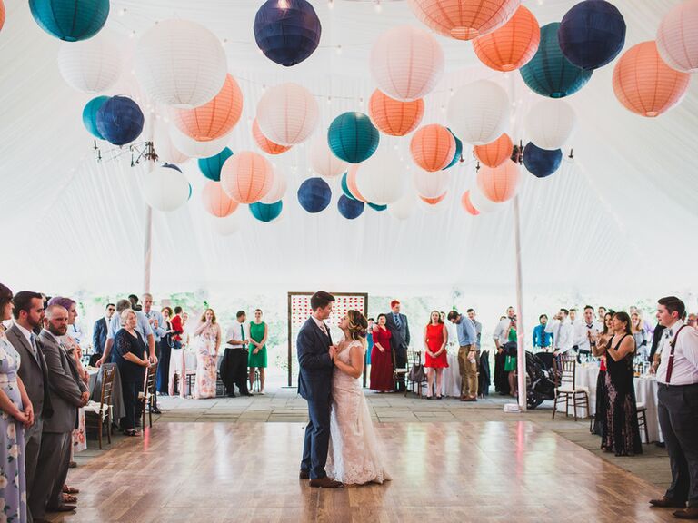 Paper lanterns suspended over a wedding dance floor