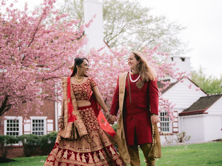 Brides holding hands and smiling