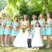 Since Candace knew exactly what color she wanted, the bridesmaid dresses were the first thing she picked out. She did tons of research online and ended up finding these short aqua dresses with illusion lace necklines and chiffon skirts at Francesca's, her favorite boutique. “I can always count on Francesca's to have what I need,” Candace says. Each woman changed up her look with a different hairstyle and her chosen neutral shoes. Bright DIY bouquets of orange daisies also helped tie it all together.