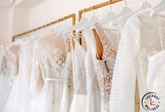Wedding dress shopping selection of dresses on a rack