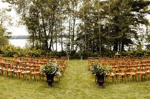 Natural Waterfront Ceremony Site with Cross-back Chairs and Aisle Decorations