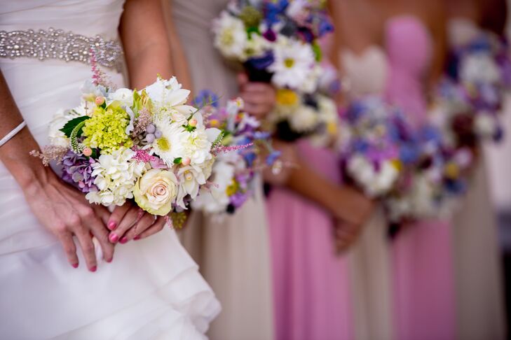 Kassandra and her bridesmaids carried small pastel bouquets with roses, hydrangeas, gerber daisies, viburnum, astilbes, silver brunia and hypericum.