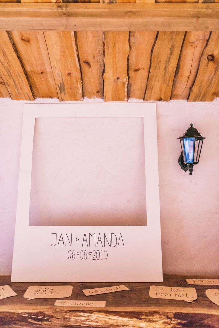 At the reception, Amanda and Jan set up a oversize frame that resembled a Polaroid picture for the photo booth. They also provided their guests with speech-bubble props.