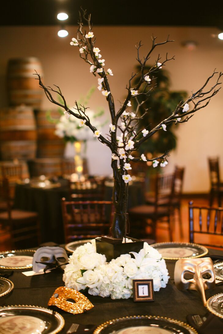 Vanessa created all of her own decor and centerpieces. She decorated manzanita trees with flower lights and made all of the masks in glitter and gold leaf for her guests to take home as favors.