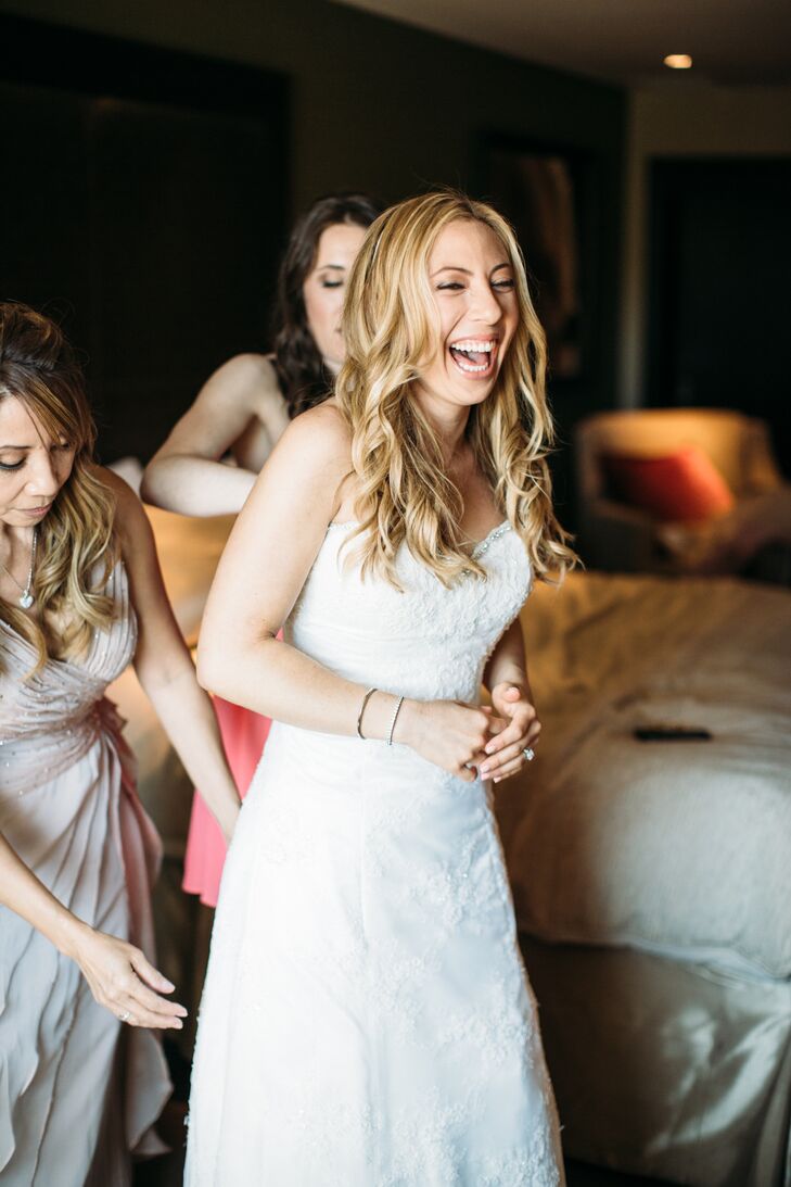 Monique fell in love with a strapless ivory Enzoani dress, accented with lace—from the beaded sweetheart neckline down the fitted silhouette.
