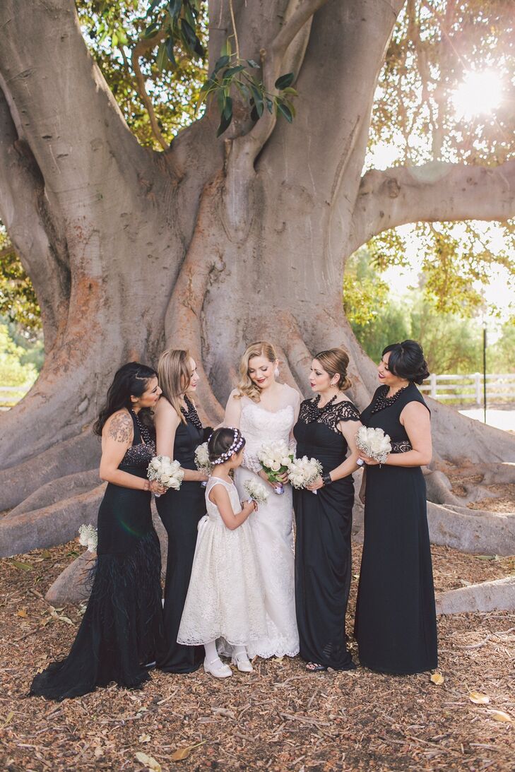 Bridesmaids wore long, floor-length black dresses, while Irene's flower girl stayed traditional in a sleeveless white dress.